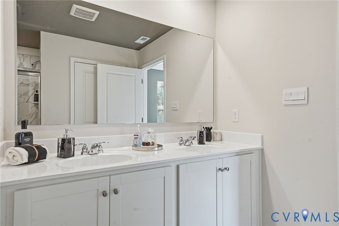 6338 Sterling Way Ruther Glen, VA 22546 - Photo 44 of 47 a bathroom with a sink and a mirror
