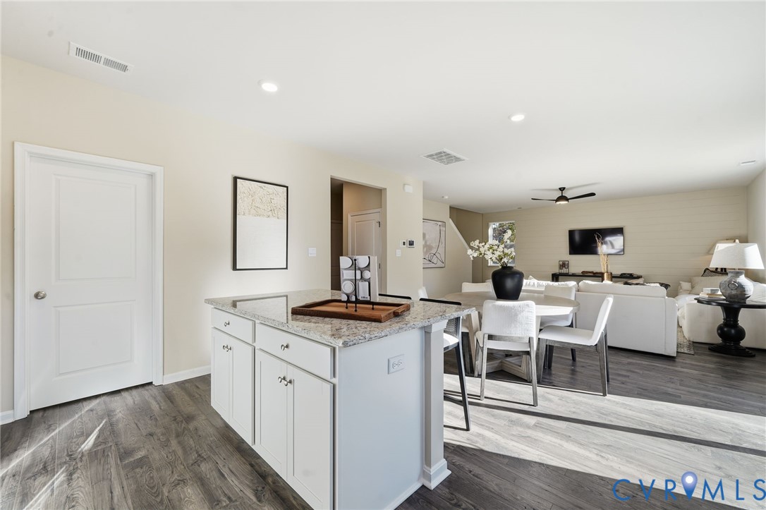 6338 Sterling Way Ruther Glen, VA 22546 - Photo 8 of 47 a view of living room filled with furniture and wooden floor