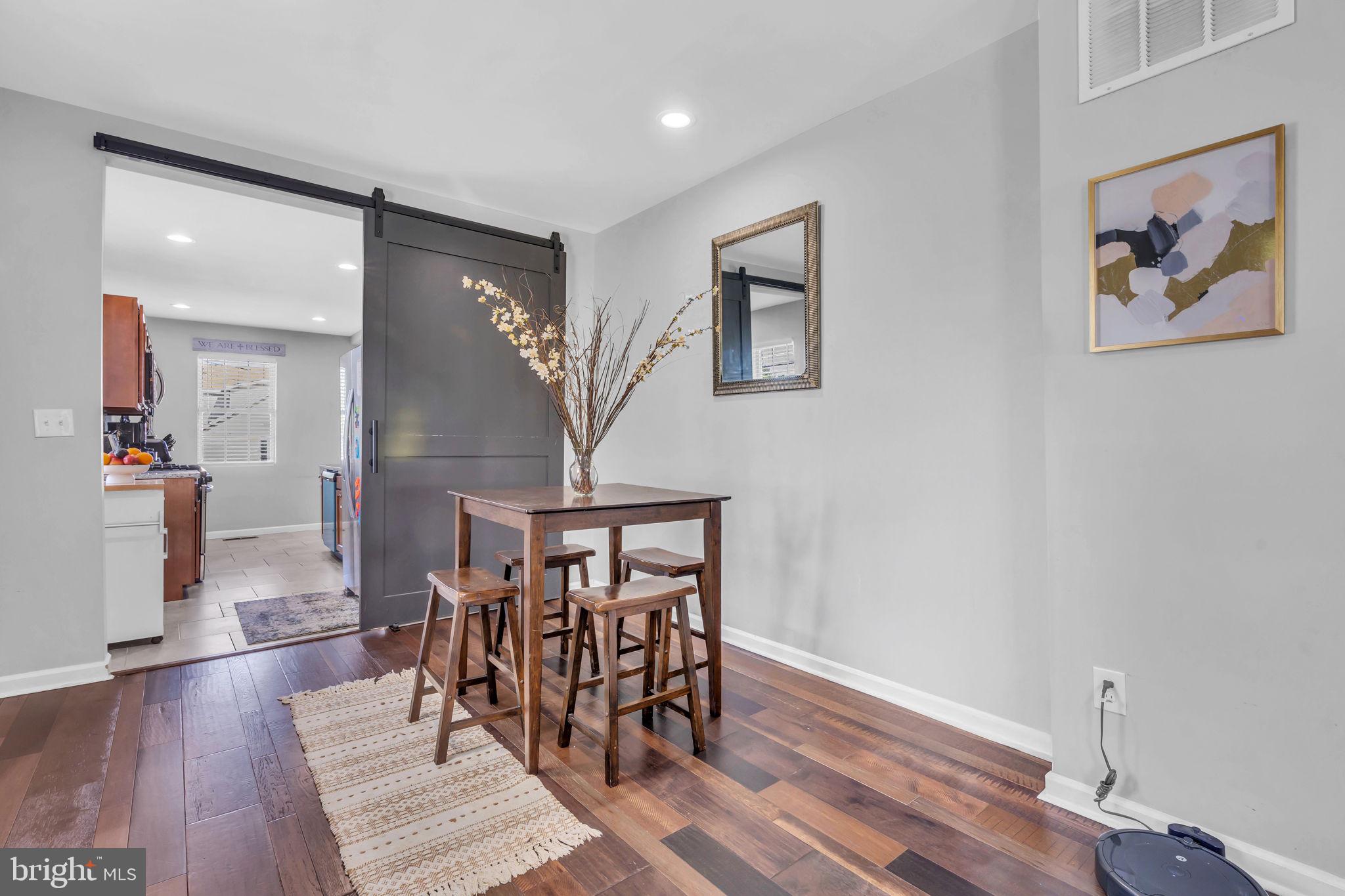 4908 1/2 Harford Road Baltimore, MD 21214 - Photo 5 of 20 a view of a livingroom with furniture and wooden floor