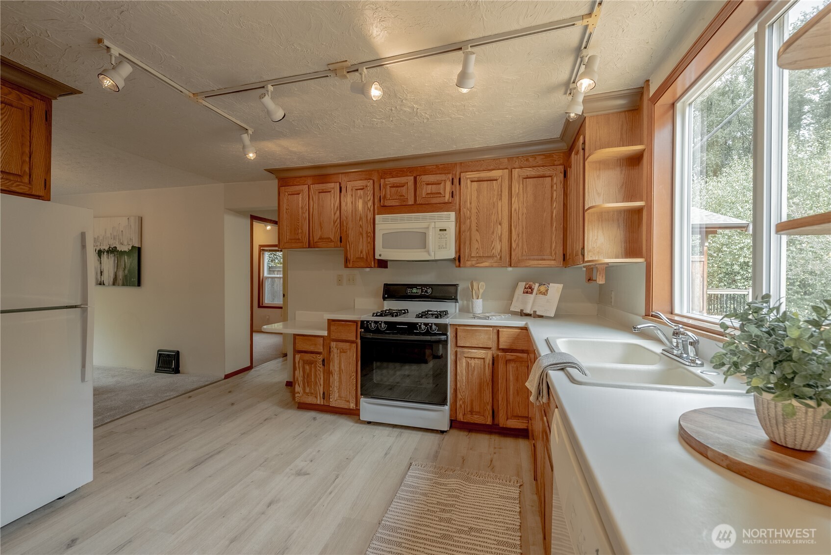 20006 68th Avenue Northeast Kenmore, WA 98028 - Photo 15 of 40 a kitchen with stainless steel appliances granite countertop a stove and a refrigerator