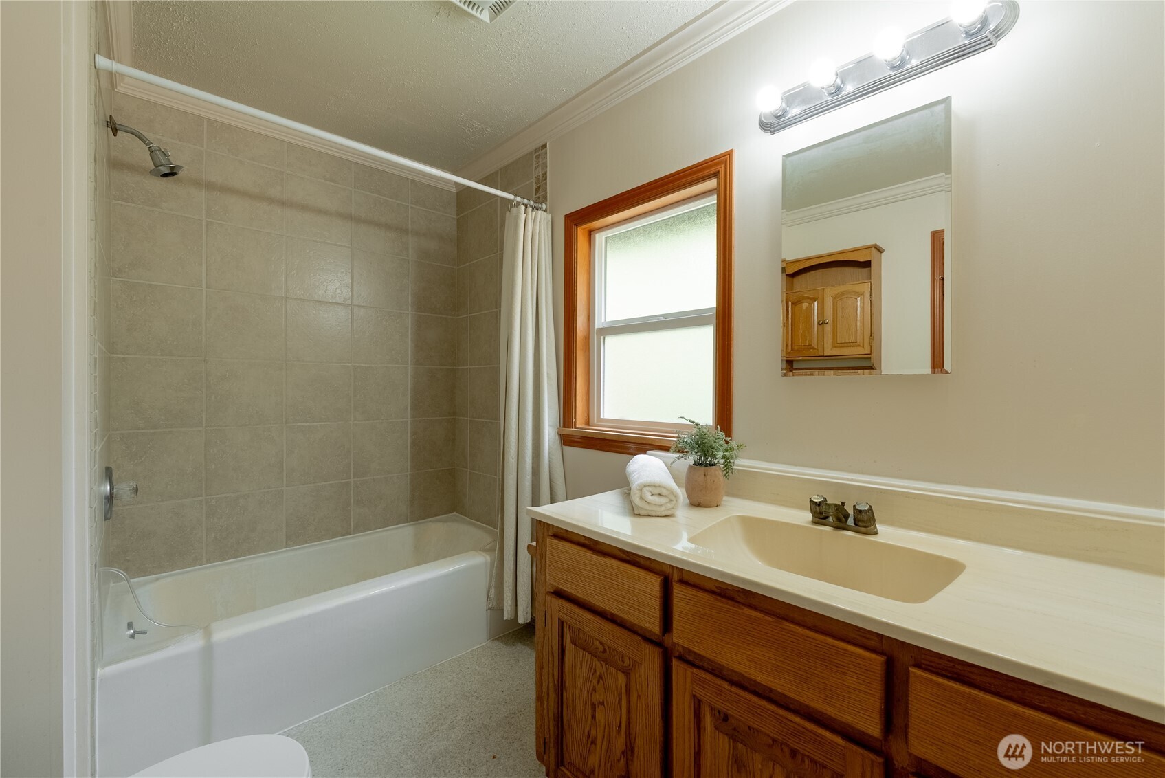 20006 68th Avenue Northeast Kenmore, WA 98028 - Photo 22 of 40 a bathroom with a tub sink shower and mirror