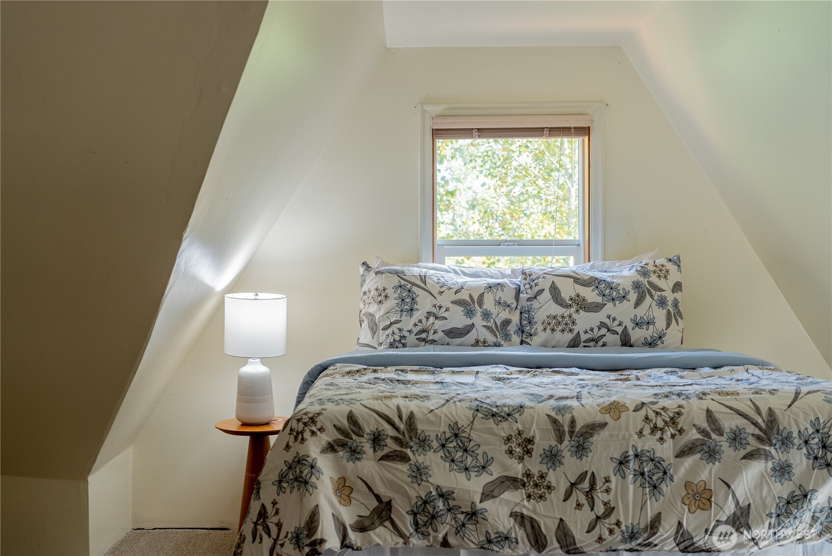 20006 68th Avenue Northeast Kenmore, WA 98028 - Photo 24 of 40 a bed sitting in a bedroom next to a window