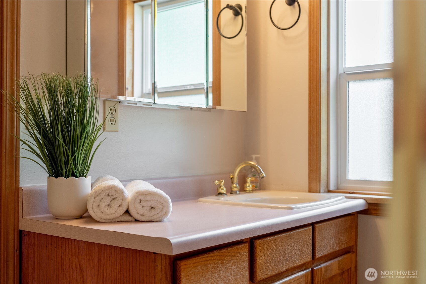 20006 68th Avenue Northeast Kenmore, WA 98028 - Photo 29 of 40 a bathroom with a granite countertop sink and a mirror