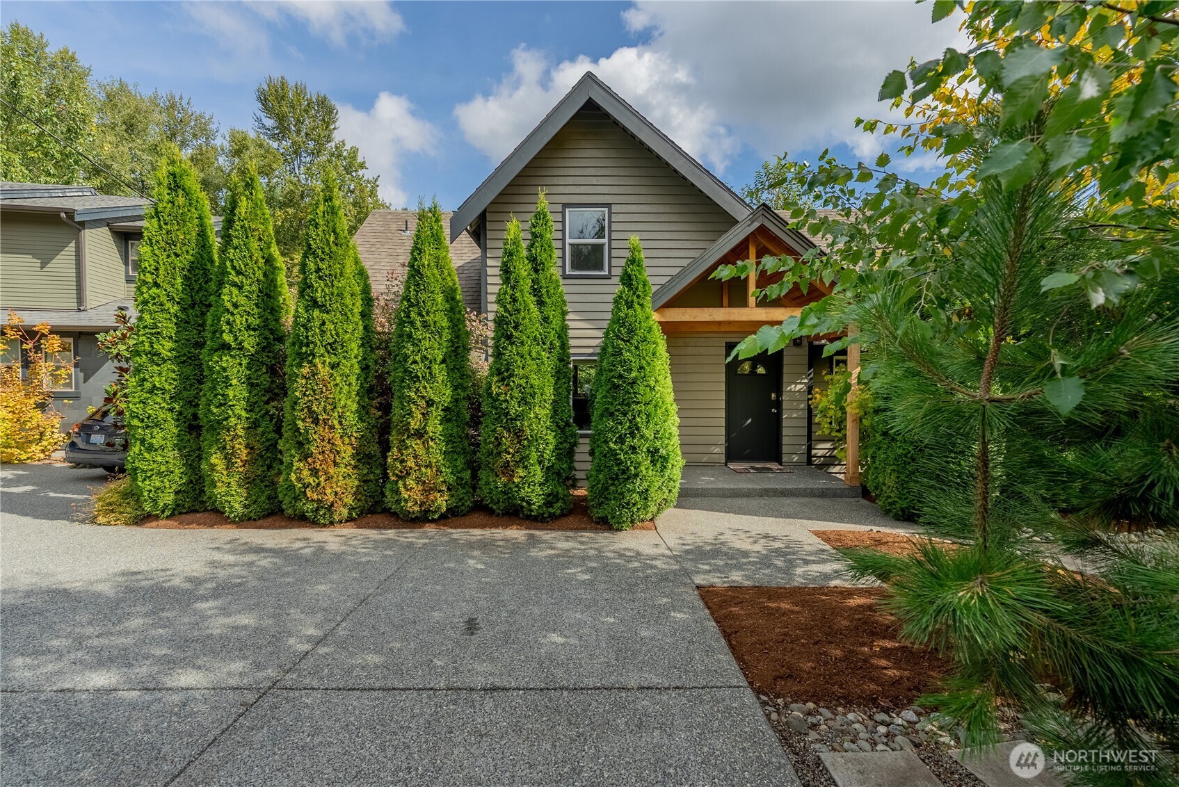 20006 68th Avenue Northeast Kenmore, WA 98028 - Photo 5 of 40 a front view of a house with garden