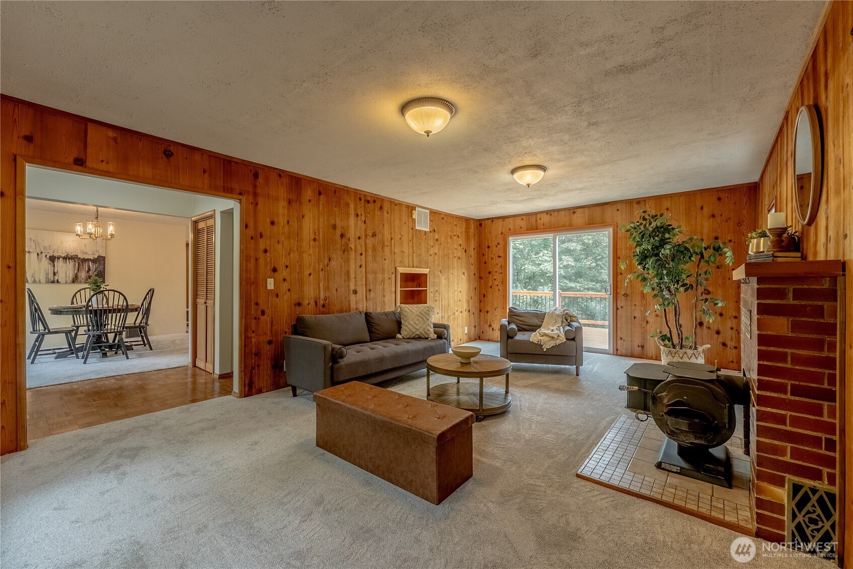 20006 68th Avenue Northeast Kenmore, WA 98028 - Photo 9 of 40 a living room with furniture and a floor to ceiling window