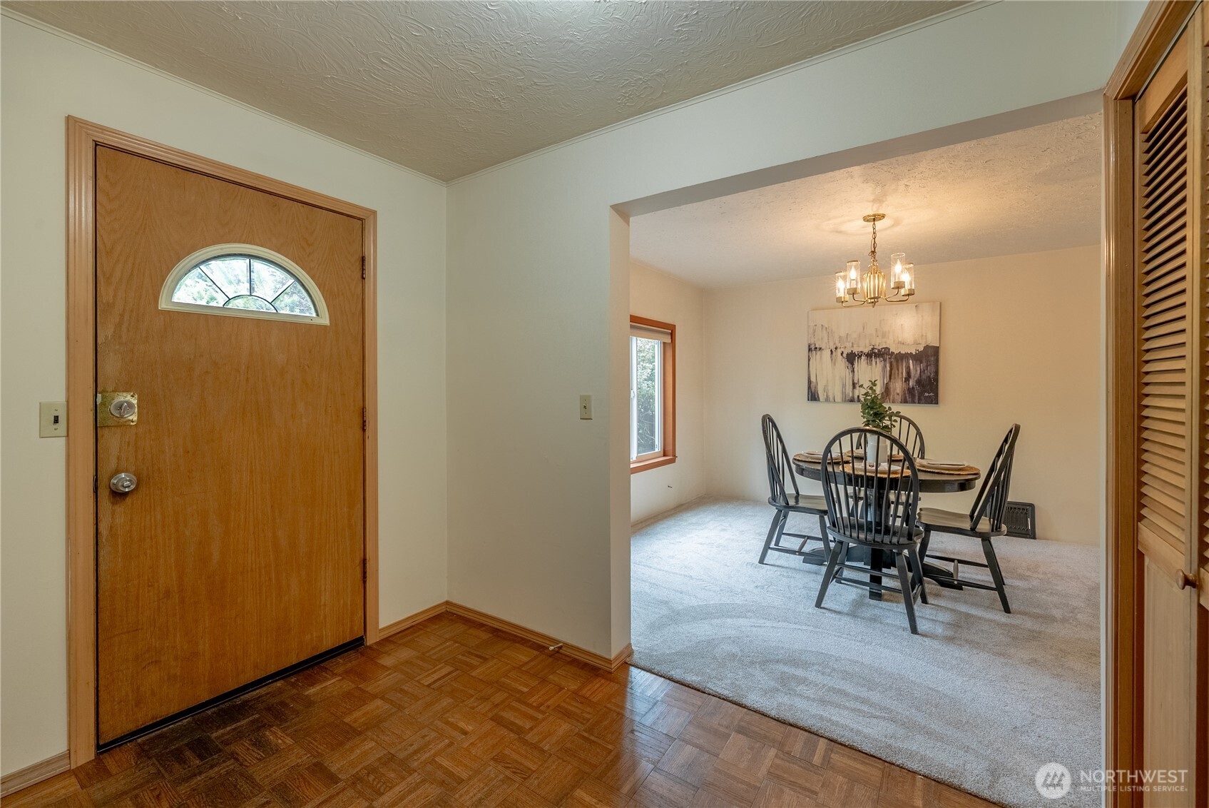 20006 68th Avenue Northeast Kenmore, WA 98028 - Photo 10 of 40 a view of a dining room with furniture and wooden floor