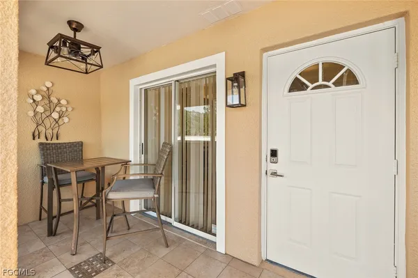 a view of a entryway and livingroom with furniture