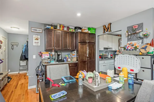 a room with furniture and a view of kitchen