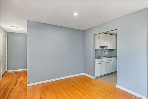 a room with a bed and cabinets