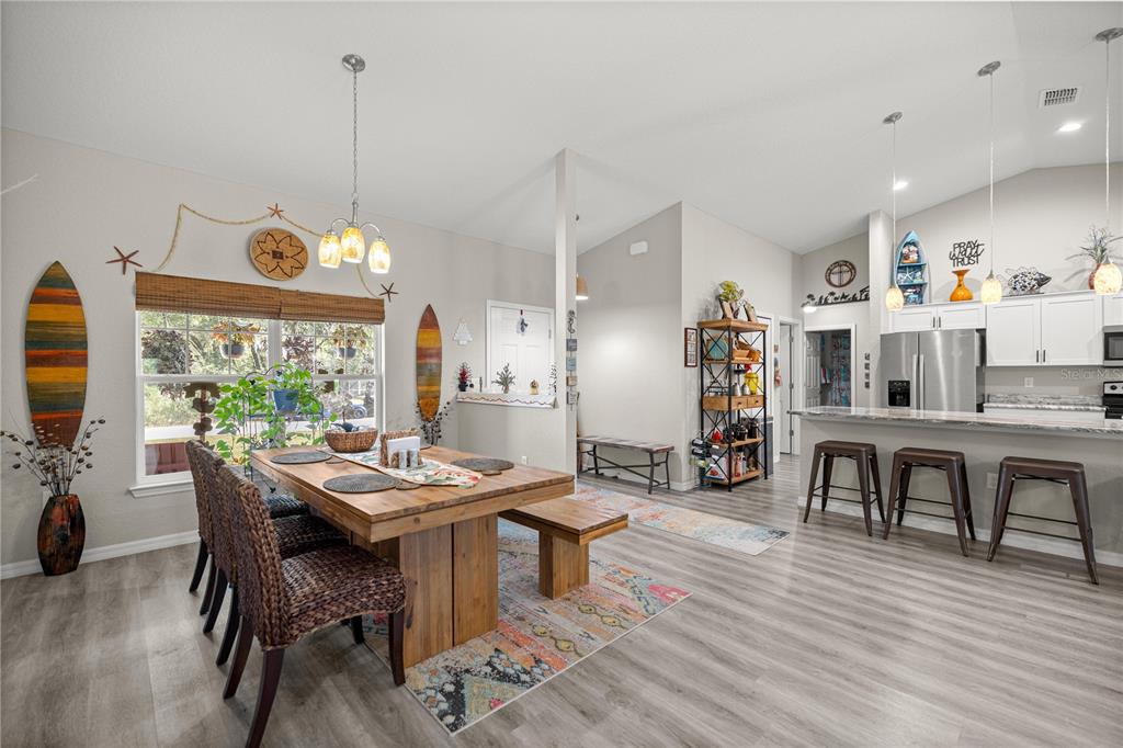 9239 Southwest 197th Circle Dunnellon, FL 34432 - Photo 11 of 57 a view of a dining room with furniture window and wooden floor