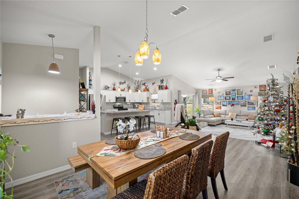 9239 Southwest 197th Circle Dunnellon, FL 34432 - Photo 12 of 57 a kitchen with a table and chairs in it