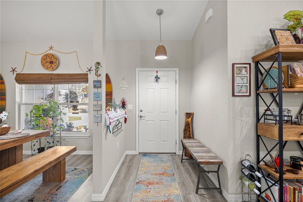 9239 Southwest 197th Circle Dunnellon, FL 34432 - Photo 13 of 57 a view of a hallway with workspace and windows