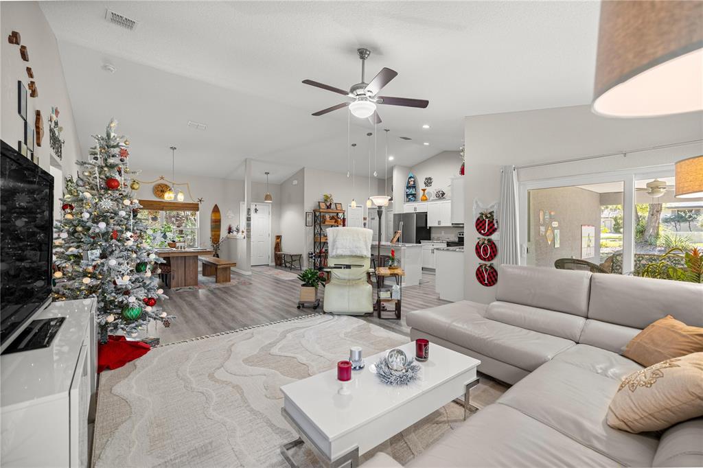 9239 Southwest 197th Circle Dunnellon, FL 34432 - Photo 16 of 57 a living room with furniture and a large window