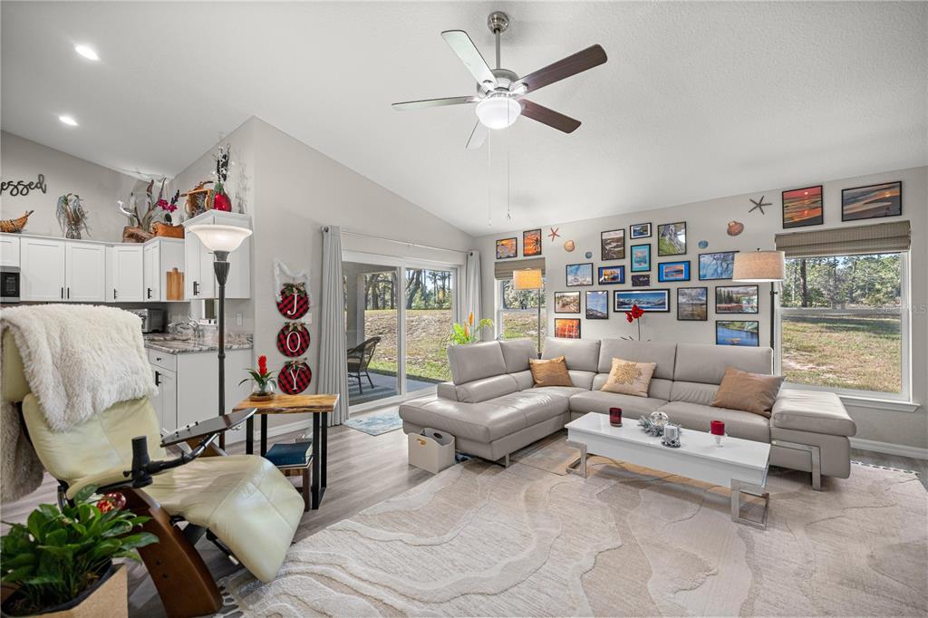 9239 Southwest 197th Circle Dunnellon, FL 34432 - Photo 18 of 57 a living room with furniture and a large window