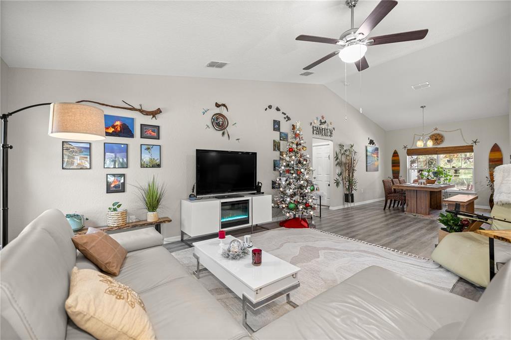 9239 Southwest 197th Circle Dunnellon, FL 34432 - Photo 19 of 57 a living room with furniture and a flat screen tv