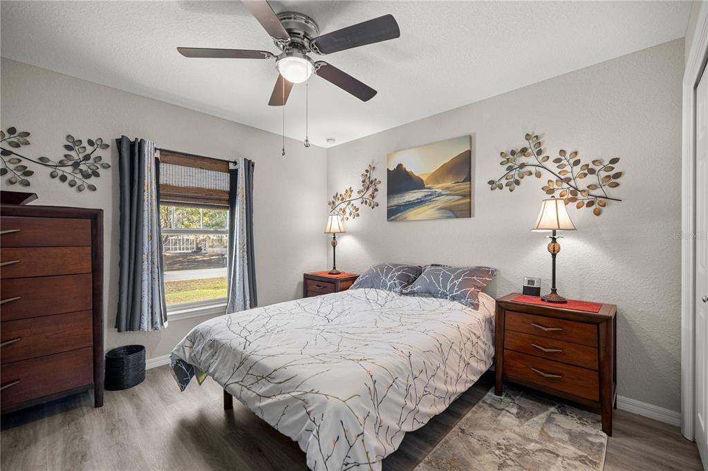 9239 Southwest 197th Circle Dunnellon, FL 34432 - Photo 20 of 57 a bedroom with a bed dresser and a window