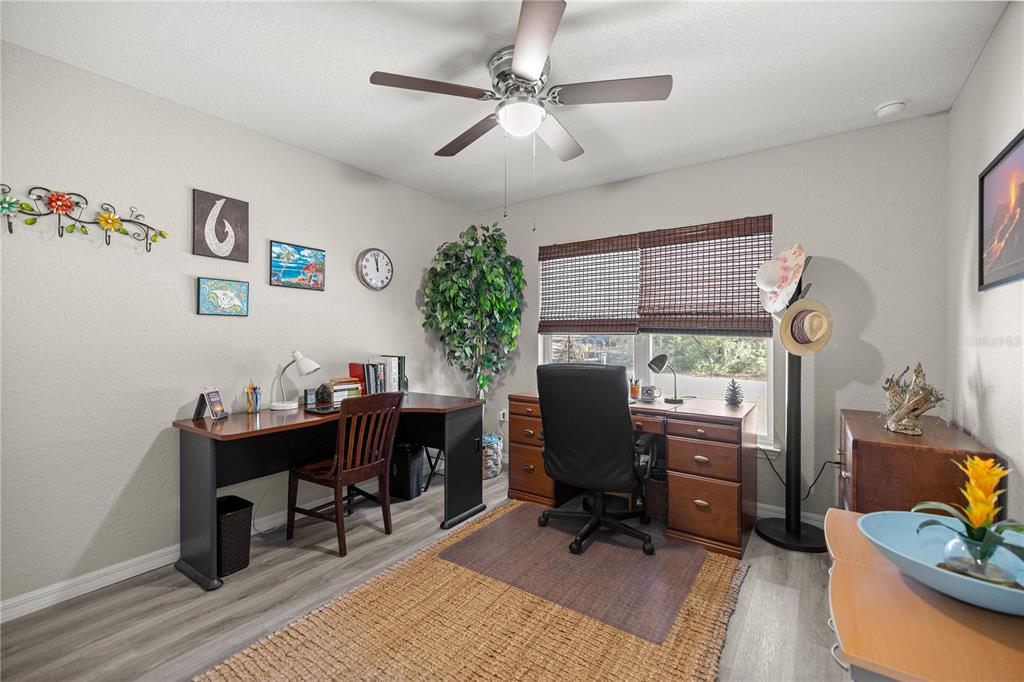 9239 Southwest 197th Circle Dunnellon, FL 34432 - Photo 24 of 57 a view of a workspace with furniture and a workspace