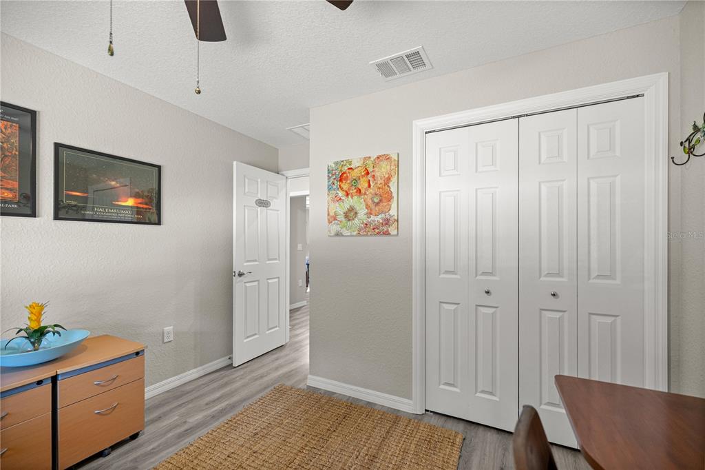 9239 Southwest 197th Circle Dunnellon, FL 34432 - Photo 25 of 57 a view of room with window and wooden floor