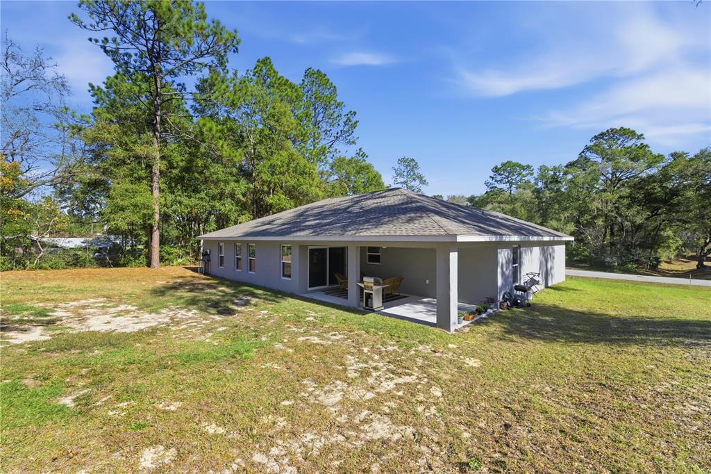 9239 Southwest 197th Circle Dunnellon, FL 34432 - Photo 38 of 57 a view of a house with a yard