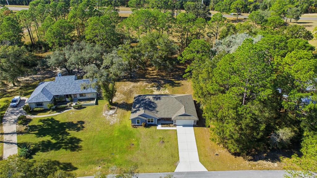 9239 Southwest 197th Circle Dunnellon, FL 34432 - Photo 5 of 57 an aerial view of a house with swimming pool