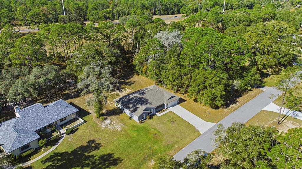 9239 Southwest 197th Circle Dunnellon, FL 34432 - Photo 6 of 57 an aerial view of a house with a yard