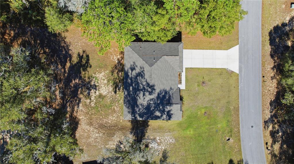 9239 Southwest 197th Circle Dunnellon, FL 34432 - Photo 7 of 57 an aerial view of a house with a yard