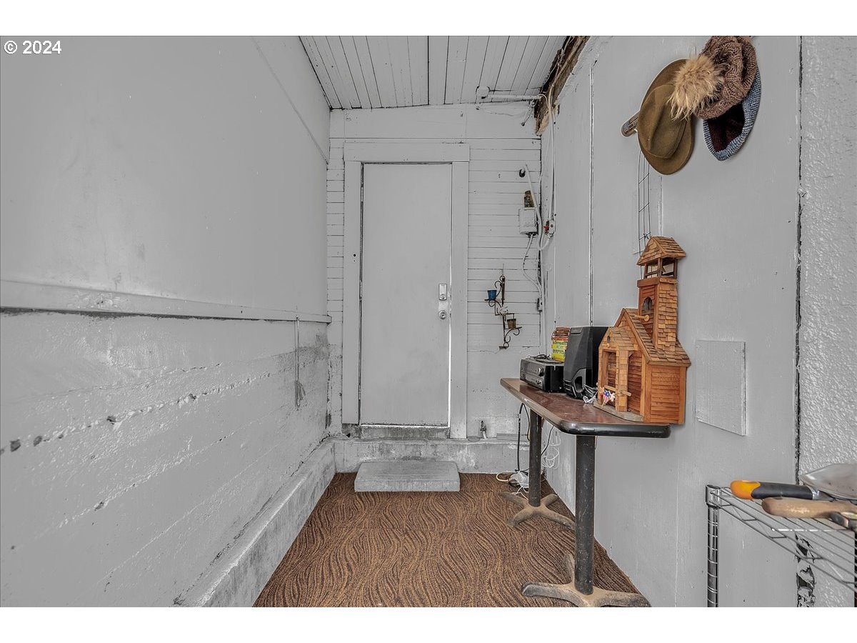 26901 Northwest St Helens Road Scappoose, OR 97056 - Photo 14 of 43 a living room with furniture and a wooden floor