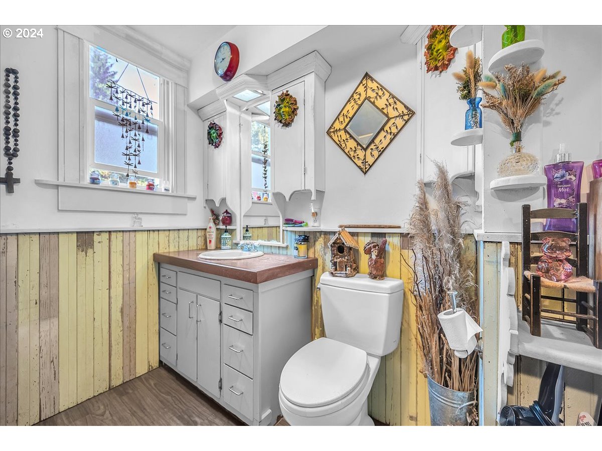 26901 Northwest St Helens Road Scappoose, OR 97056 - Photo 16 of 43 a bathroom with a toilet a sink and a mirror