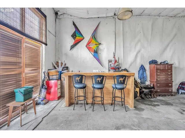 a living room with lots of furniture and appliances