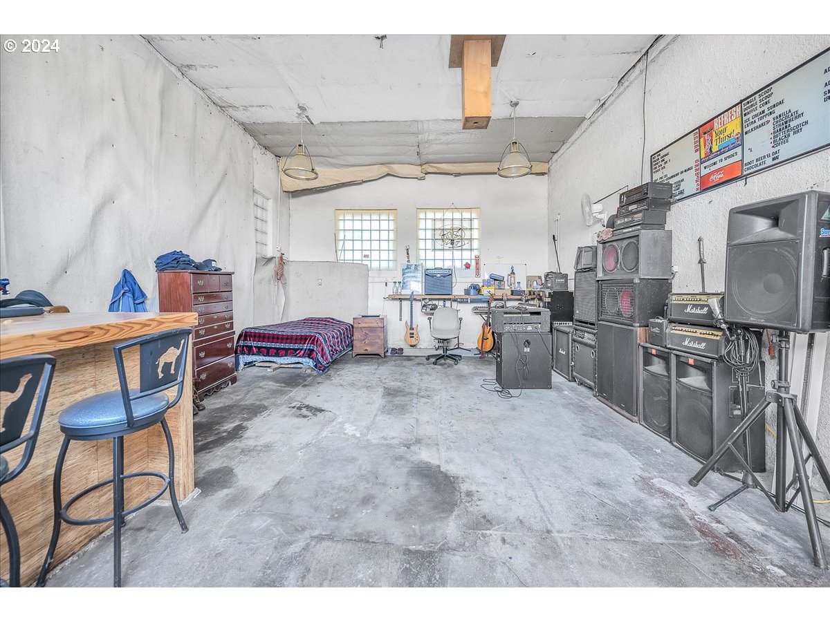 26901 Northwest St Helens Road Scappoose, OR 97056 - Photo 23 of 43 a living room with lots of furniture and appliances