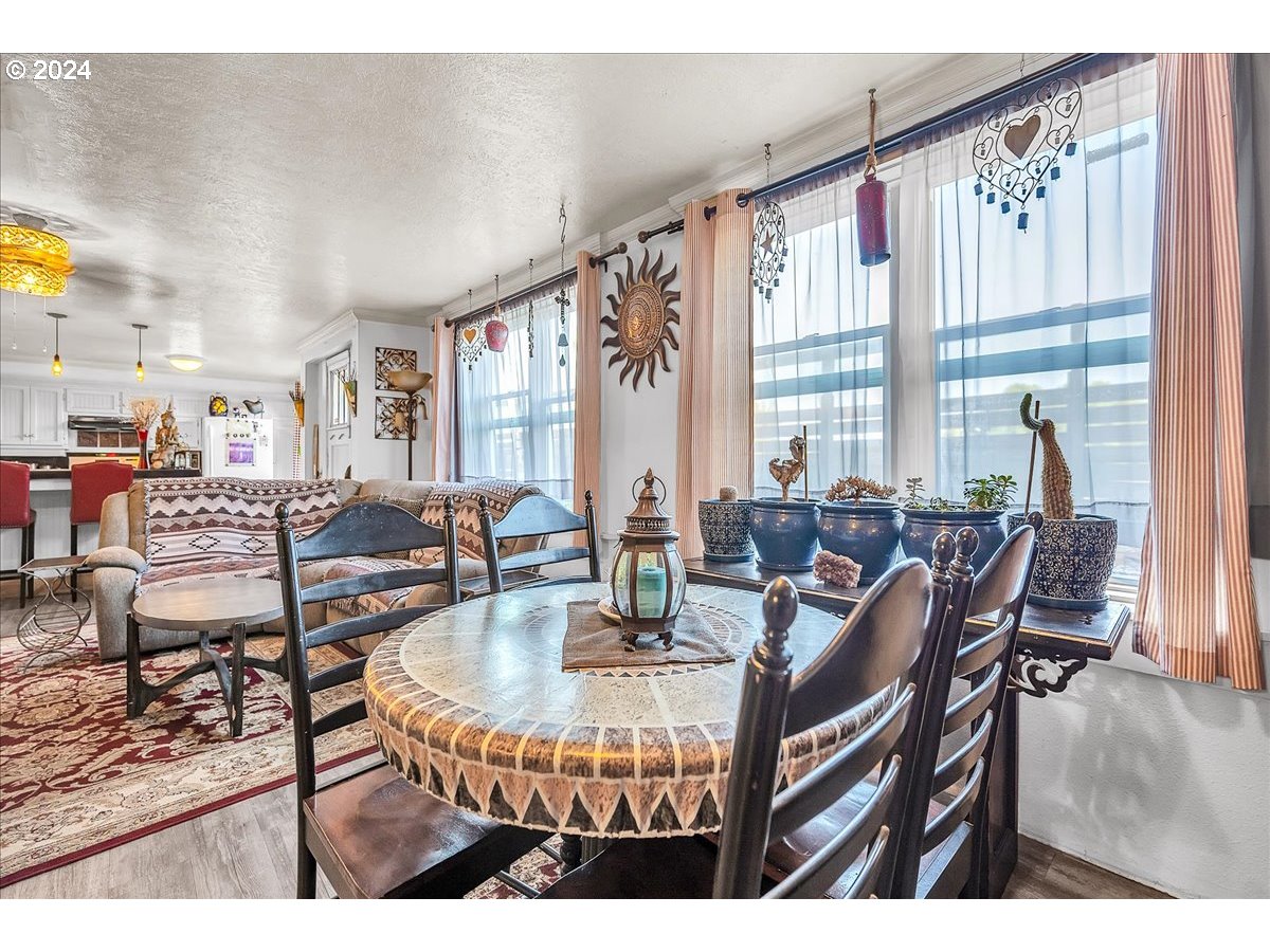 26901 Northwest St Helens Road Scappoose, OR 97056 - Photo 25 of 43 a dining room with furniture and wooden floor