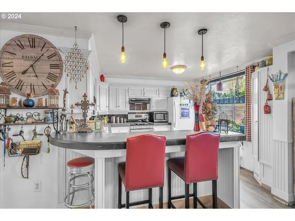 a living room with furniture a dining table and kitchen view