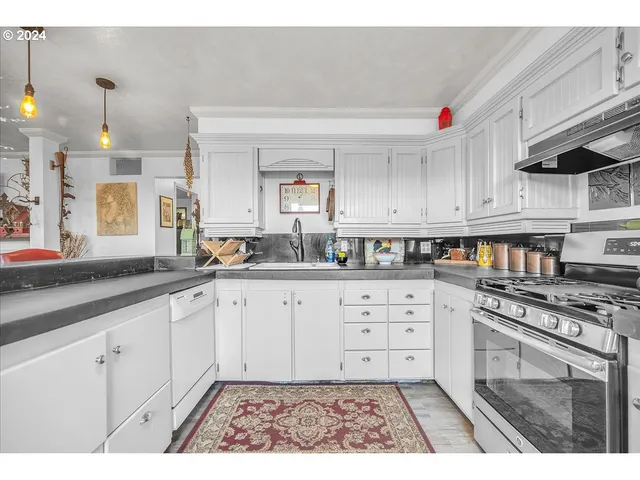 a view of house with backyard