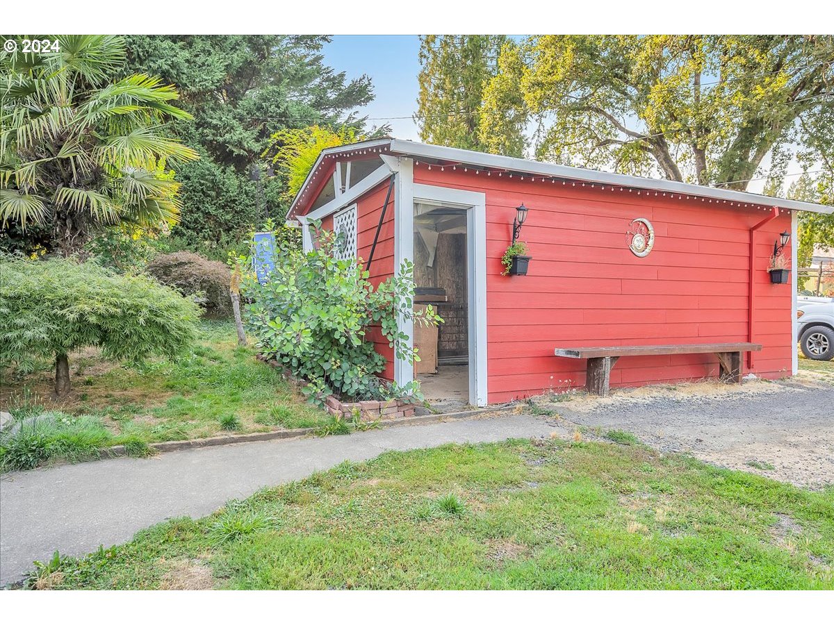 26901 Northwest St Helens Road Scappoose, OR 97056 - Photo 35 of 43 a view of a backyard with plants and large trees