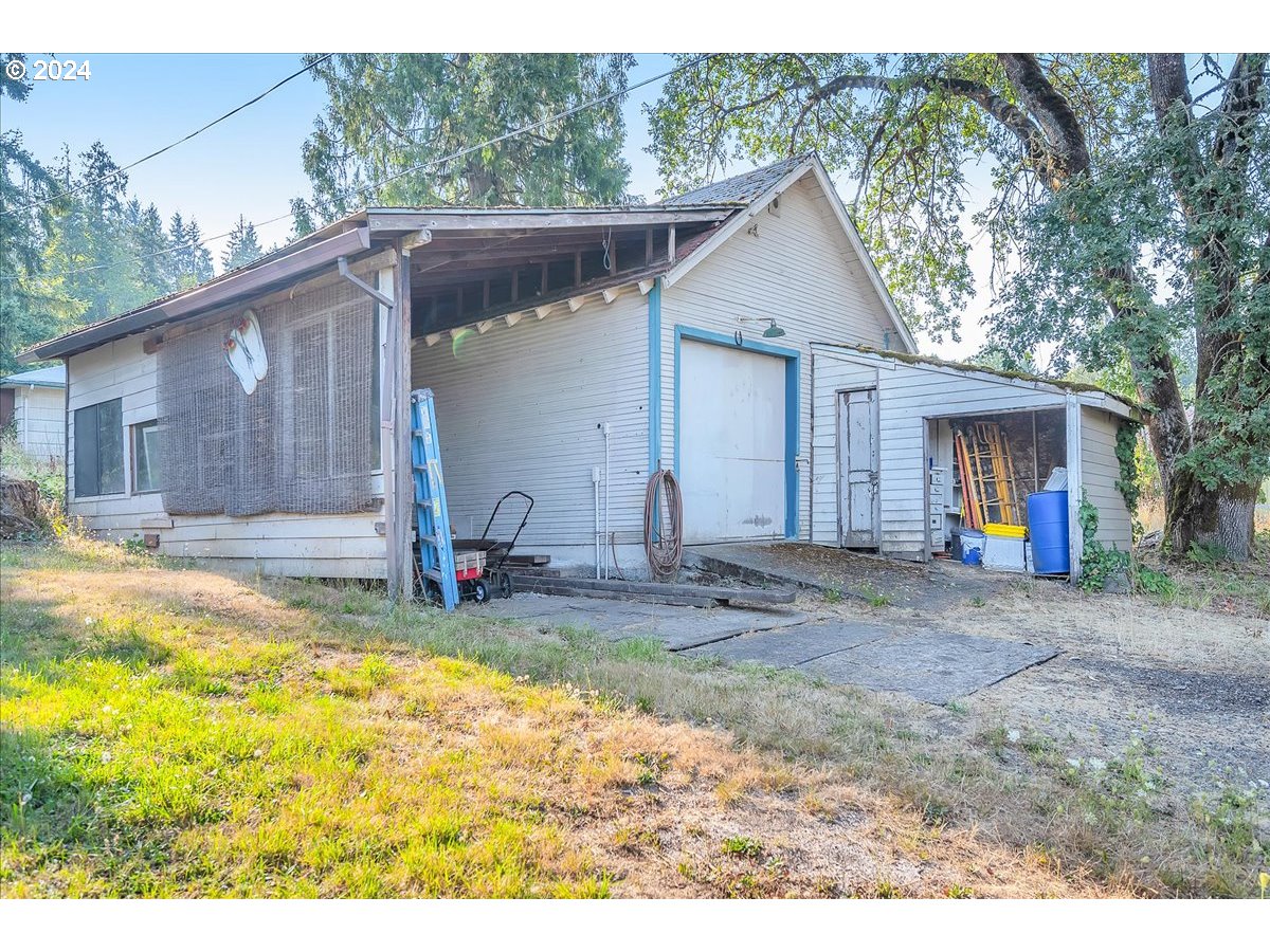 26901 Northwest St Helens Road Scappoose, OR 97056 - Photo 40 of 43 a view of a house with backyard and sitting area