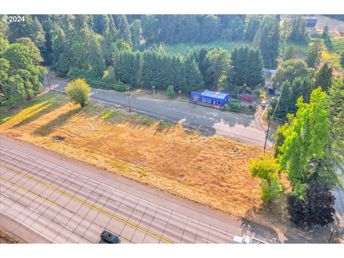 26901 Northwest St Helens Road Scappoose, OR 97056 - Photo 4 of 43 a view of a backyard and a lake view