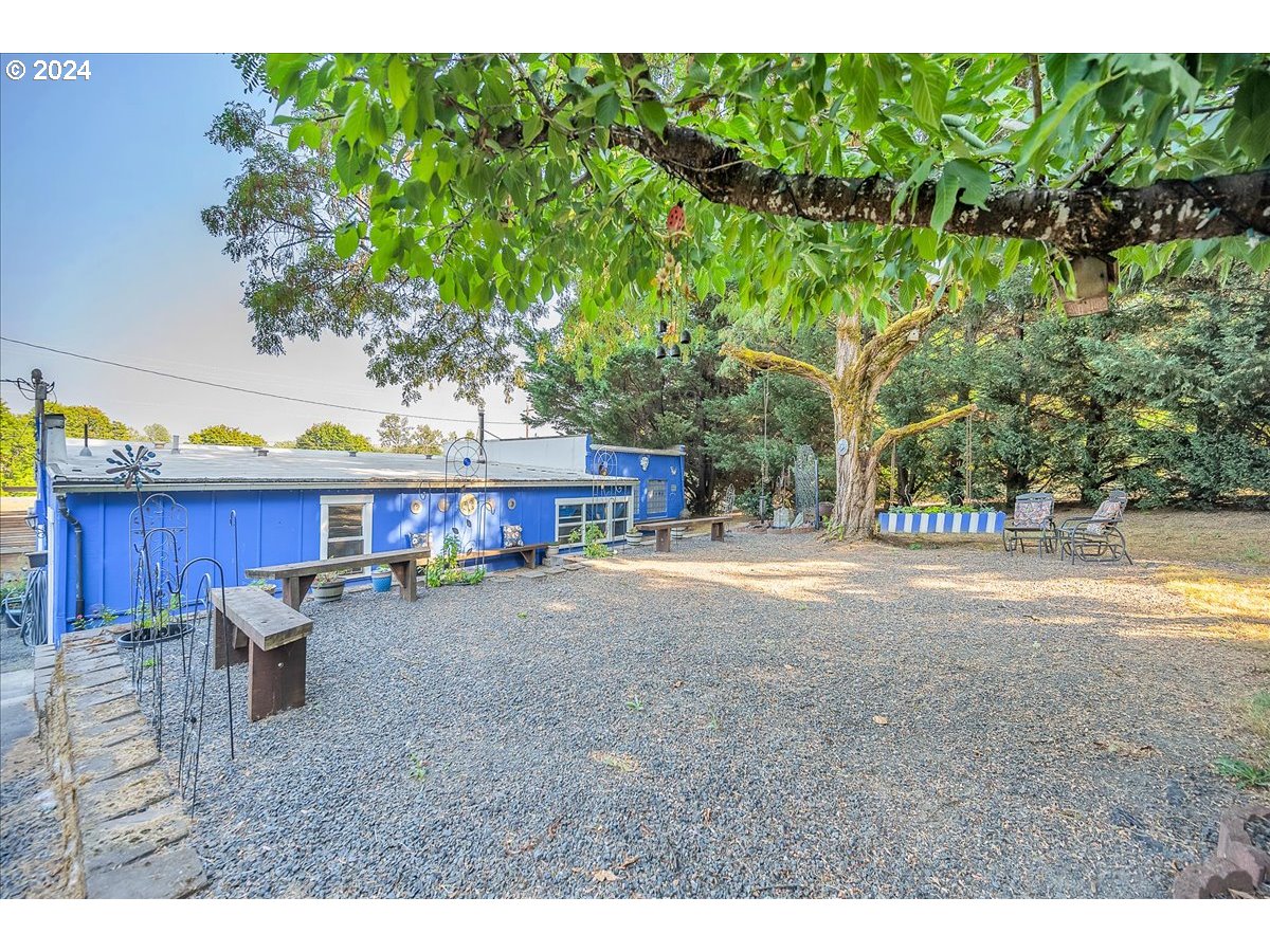 26901 Northwest St Helens Road Scappoose, OR 97056 - Photo 41 of 43 a view of a house with backyard and a patio