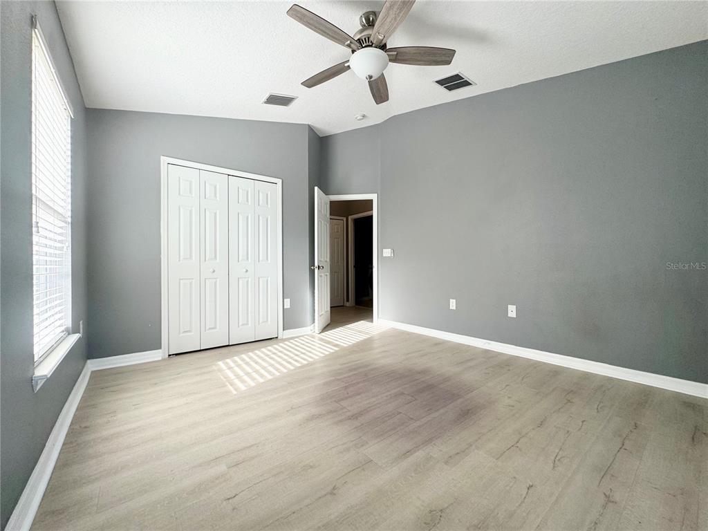 6723 Breezy Palm Drive Riverview, FL 33578 - Photo 13 of 16 an empty room with fan and windows