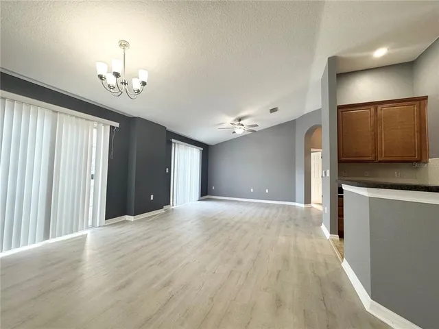 a view of a kitchen with a dishwasher cabinets and wooden floor