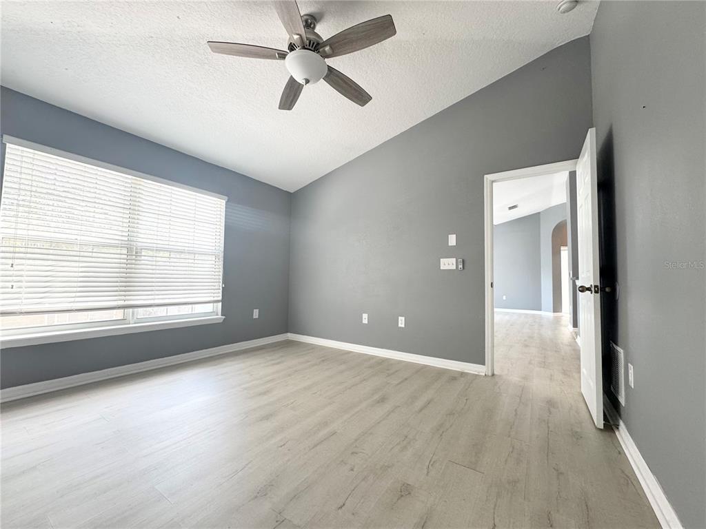 6723 Breezy Palm Drive Riverview, FL 33578 - Photo 10 of 16 a view of a big room with wooden floor and windows in a room