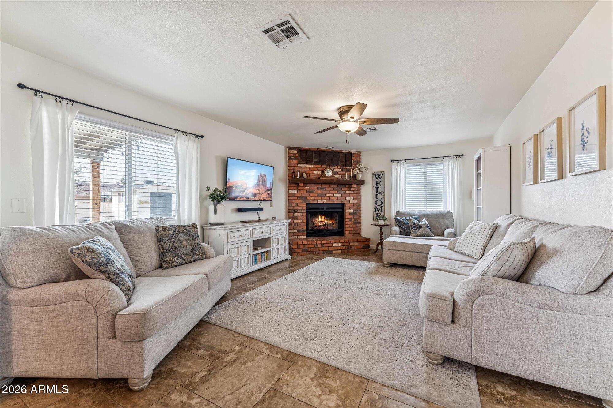 2019 East Butler Street Chandler, AZ 85225 - Photo 18 of 27 a living room with furniture and a large window