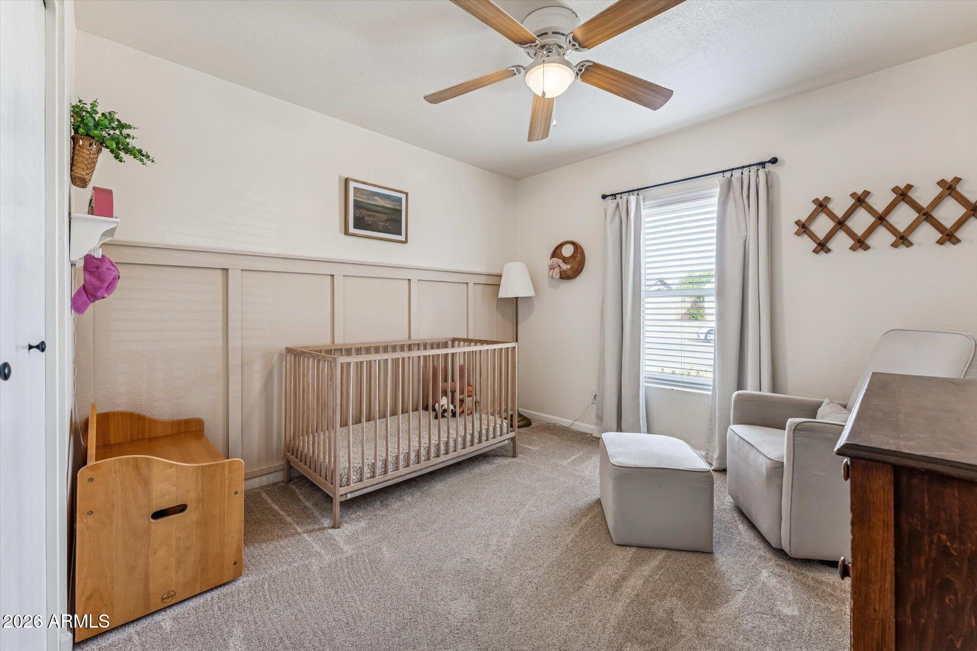 2019 East Butler Street Chandler, AZ 85225 - Photo 22 of 27 a view of a bedroom with furniture and a window