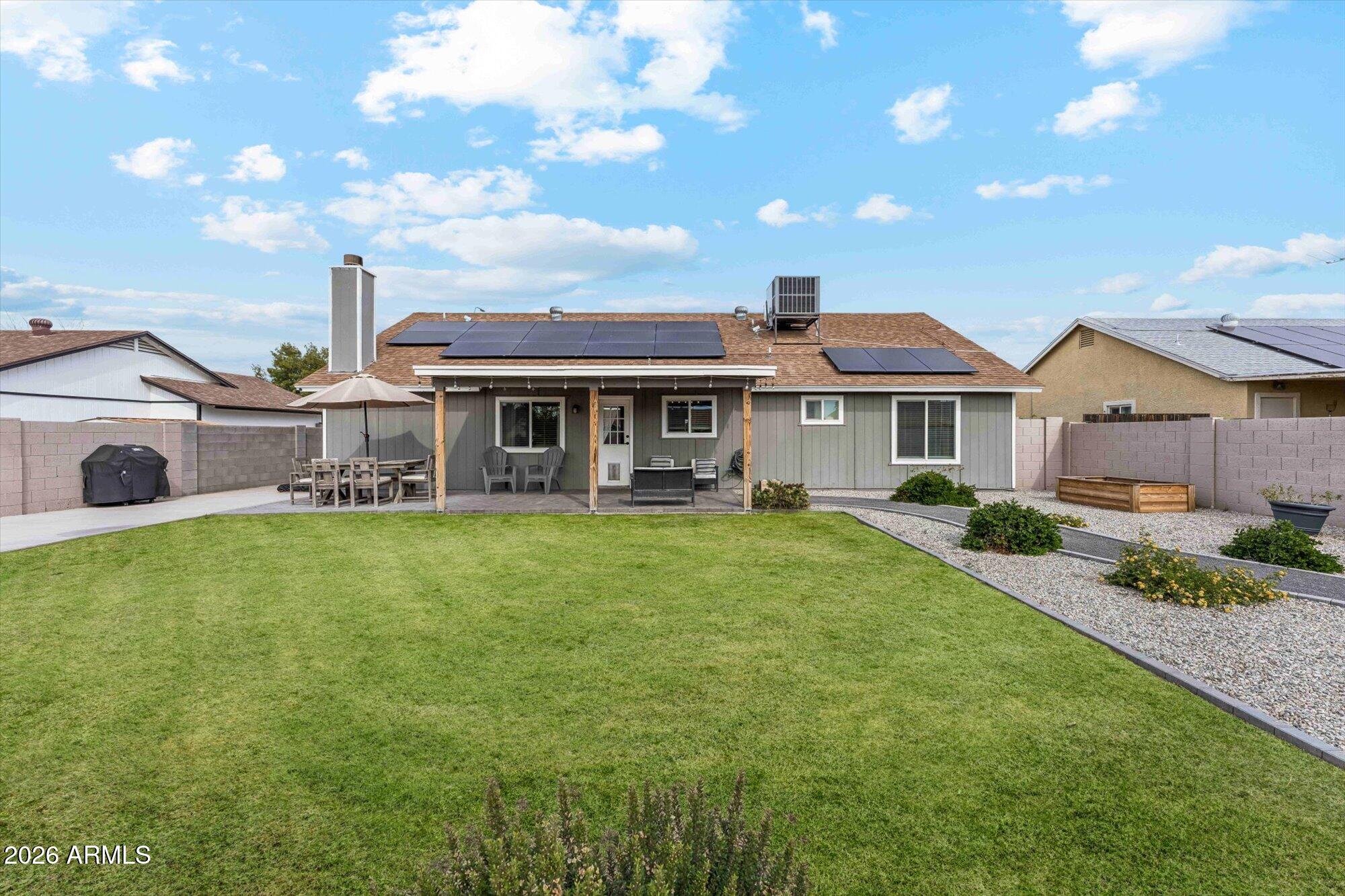 2019 East Butler Street Chandler, AZ 85225 - Photo 25 of 27 a front view of a house with a garden