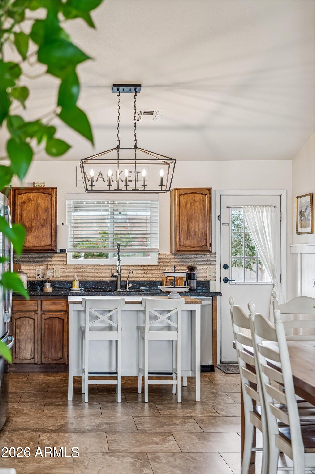 2019 East Butler Street Chandler, AZ 85225 - Photo 3 of 27 a kitchen with lots of counter top space and furniture