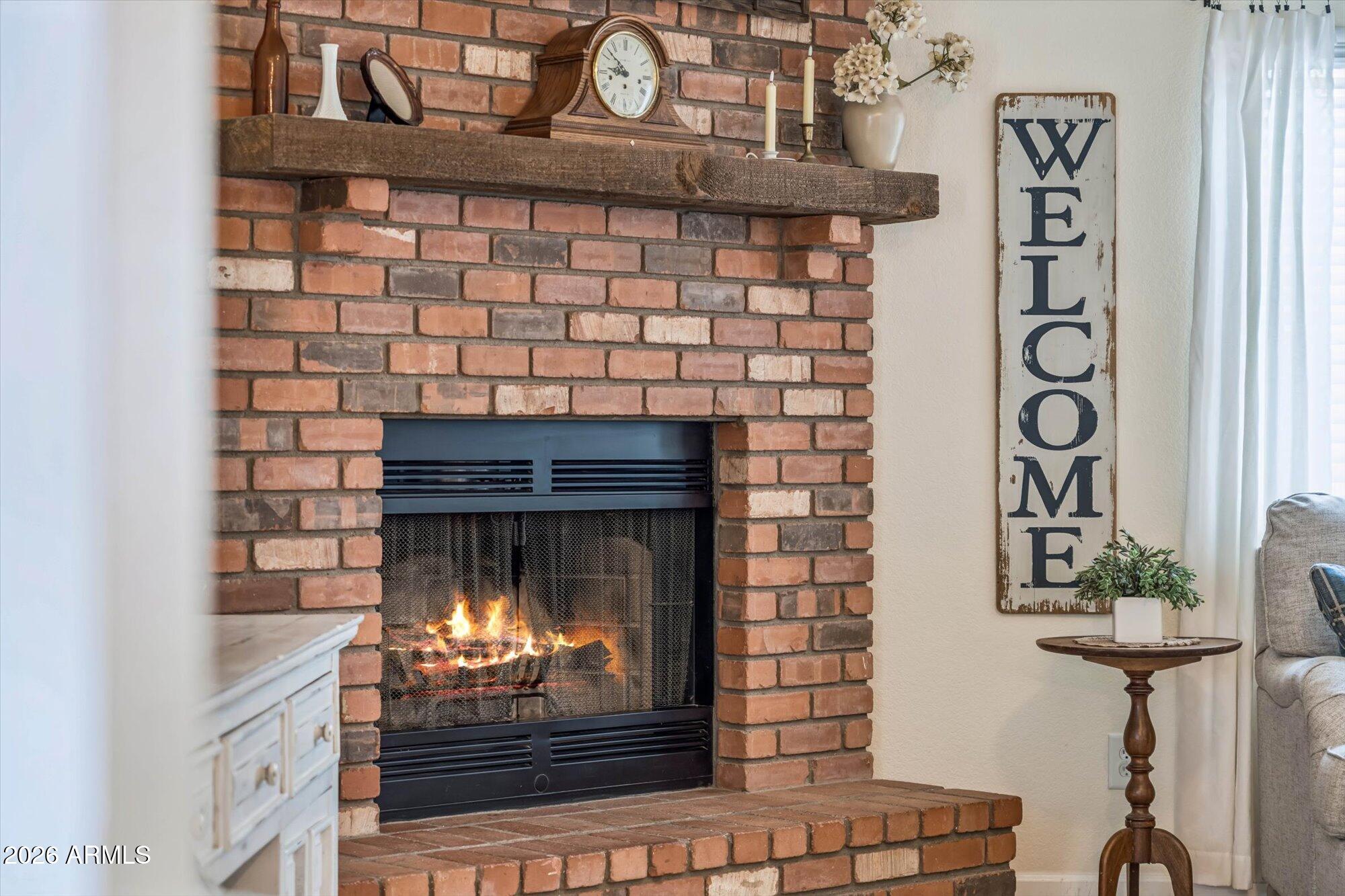 2019 East Butler Street Chandler, AZ 85225 - Photo 4 of 27 a fireplace with a clock on wall