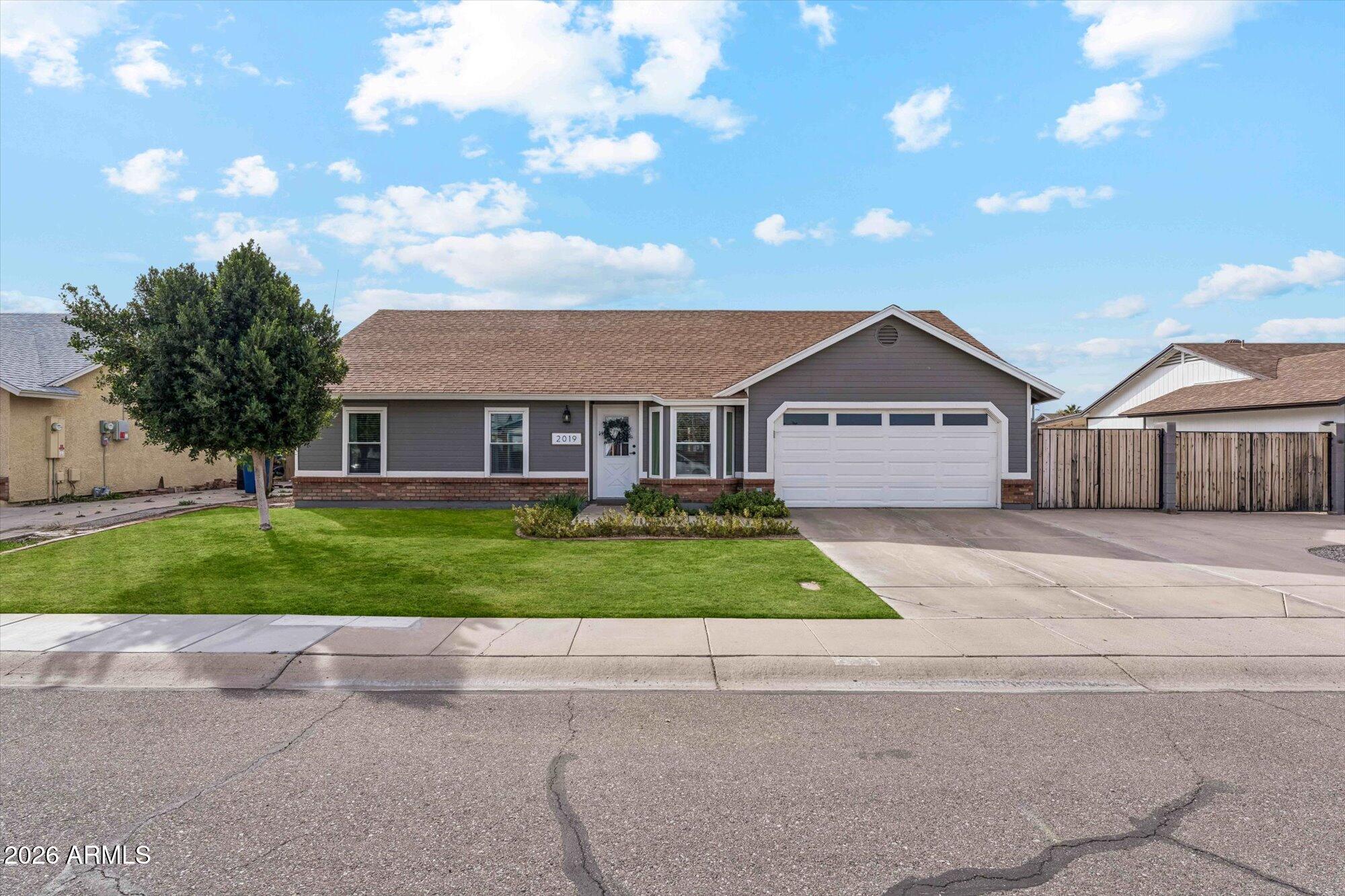 2019 East Butler Street Chandler, AZ 85225 - Photo 7 of 27 a front view of a house with a yard