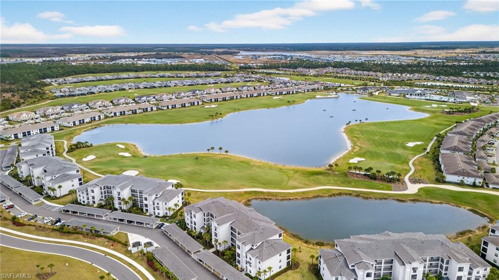 43985 Boardwalk Loop, Unit 2115 Punta Gorda, FL 33982 - Photo 23 of 28 an aerial view of a swimming pool with a lawn chairs