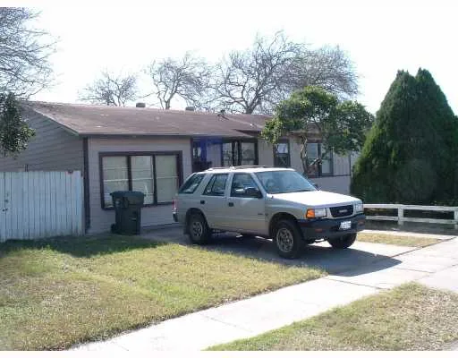 a car parked in front of a house