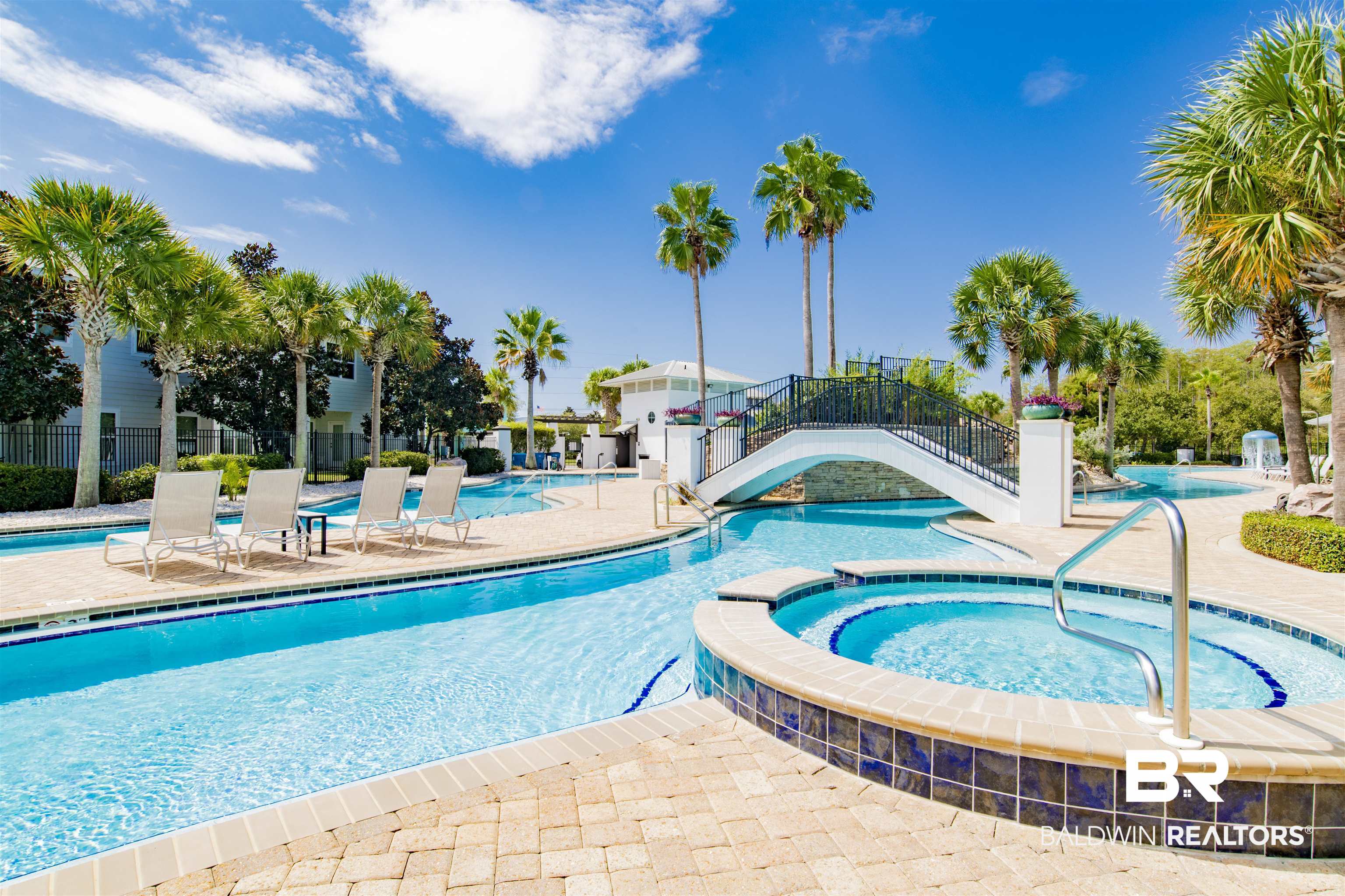 23893 Cypress Crossing Orange Beach, AL 36561 - Photo 16 of 22 Community pool with a hot tub and a patio
