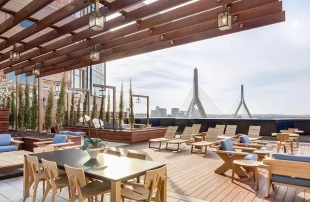 a patio with yard table and chairs